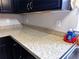 Close-up of kitchen countertop with faux-granite, sink and dish soap at 20386 Sw 95Th St, Dunnellon, FL 34431