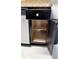 Kitchen base cabinet with open door showing interior shelving at 20386 Sw 95Th St, Dunnellon, FL 34431
