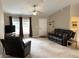 Bright living room with lots of space, ceiling fan, and comfortable couches at 20386 Sw 95Th St, Dunnellon, FL 34431