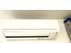 Close-up of Mitsubishi mini-split A/C unit for garage at 20386 Sw 95Th St, Dunnellon, FL 34431