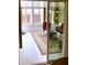 Sunroom with tile floors, white walls, wicker furniture, and large windows at 20386 Sw 95Th St, Dunnellon, FL 34431