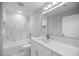 Stylish bathroom featuring a tub/shower combo with tile surround and modern fixtures at 20812 Sw Cardinal Ave, Dunnellon, FL 34431