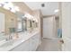 Bathroom with a double vanity, white cabinets, and a neutral color palette that enhances the serene atmosphere at 20921 Sw 36Th St, Dunnellon, FL 34431