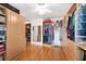 Spacious walk-in closet featuring custom wood cabinets and shelving to maximize storage at 20921 Sw 36Th St, Dunnellon, FL 34431
