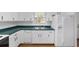Efficient kitchen with white cabinetry, sleek countertops, and essential appliances included at 20921 Sw 36Th St, Dunnellon, FL 34431