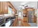 Functional kitchen featuring stainless steel appliances, dark countertops, and plentiful cabinet space, ideal for cooking and storage at 20921 Sw 36Th St, Dunnellon, FL 34431
