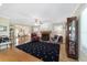 Cozy living room with fireplace, hardwood floors, and ample natural light, perfect for relaxation and entertaining guests at 20921 Sw 36Th St, Dunnellon, FL 34431