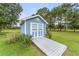 Well-maintained shed with a charming design, providing extra storage and functionality on the property at 20921 Sw 36Th St, Dunnellon, FL 34431
