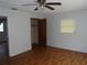 Bedroom featuring a ceiling fan, laminate flooring, and a closet with an open door at 2912 Ne 24Th Ct, Ocala, FL 34479