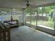 A spacious screened porch with view of the backyard and street at 2912 Ne 24Th Ct, Ocala, FL 34479