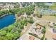 Stunning aerial view of a community with lush greenery, serene lakes, and beautiful homes with vibrant colors at 347 Oak Lane Dr, Ocala, FL 34472