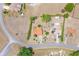 High-angle showcases properties with terracotta roofs, complemented by green trees and swimming pools in a residential area at 347 Oak Lane Dr, Ocala, FL 34472