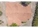 An aerial view of a roof, showcasing its multiple angles, tile pattern, and the surrounding vegetation at 347 Oak Lane Dr, Ocala, FL 34472