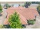 Unique perspective of a terracotta roof amidst a verdant landscape of trees, capturing a natural and calming scene at 347 Oak Lane Dr, Ocala, FL 34472