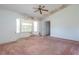 Spacious bedroom featuring a ceiling fan and large windows at 347 Oak Lane Dr, Ocala, FL 34472