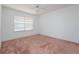 Bedroom featuring a ceiling fan and window at 347 Oak Lane Dr, Ocala, FL 34472