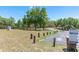 Scenic community park featuring mature trees, a playground, walking paths, and a convenient information sign at 347 Oak Lane Dr, Ocala, FL 34472