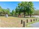 Beautiful community park offering a peaceful setting with green grass, a playground, mature trees, and a walking path at 347 Oak Lane Dr, Ocala, FL 34472