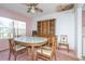 Dining room with round table, wood chairs, and a large wooden hutch at 347 Oak Lane Dr, Ocala, FL 34472