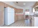 Kitchen showcasing ample cabinet space, white appliances, and tiled floors at 347 Oak Lane Dr, Ocala, FL 34472