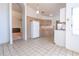 Bright kitchen with tiled floors, wooden cabinets, and open flow to the living spaces at 347 Oak Lane Dr, Ocala, FL 34472