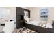 Stylish bedroom with a murphy bed desk setup, offering functional space for work or relaxation at 357 Hickory Course Trl, Ocala, FL 34472