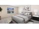 Cozy bedroom with a comfortable bed, soft lighting, and serene decor for a relaxing atmosphere at 357 Hickory Course Trl, Ocala, FL 34472