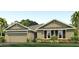 Charming single-story home featuring a two-car garage, well-maintained lawn and professionaly landscaped front yard at 357 Hickory Course Trl, Ocala, FL 34472