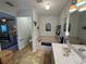 Bright bathroom featuring a bathtub, vanity, and ample natural light, creating a serene and inviting space at 3579 Sw Shorewood Dr, Dunnellon, FL 34431