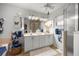 Well-lit bathroom with double vanity, ample cabinet space, and modern fixtures at 3579 Sw Shorewood Dr, Dunnellon, FL 34431