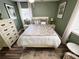 Comfortable bedroom with tasteful decor, side tables and windows that provide natural light at 3579 Sw Shorewood Dr, Dunnellon, FL 34431