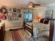 Charming bedroom with a queen-size bed, ceiling fan, and sliding doors to patio at 3579 Sw Shorewood Dr, Dunnellon, FL 34431