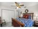 Comfortable bedroom featuring a ceiling fan, double closets, and serene atmosphere at 3579 Sw Shorewood Dr, Dunnellon, FL 34431