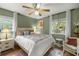 Calm bedroom featuring soft lighting, hardwood floors, and a serene atmosphere at 3579 Sw Shorewood Dr, Dunnellon, FL 34431