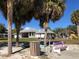 Community area with covered picnic spots, playground, mature trees and outdoor seating at 3579 Sw Shorewood Dr, Dunnellon, FL 34431