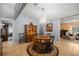 Elegant dining room with a chandelier, hardwood floors, and a hutch, perfect for formal gatherings at 3579 Sw Shorewood Dr, Dunnellon, FL 34431