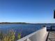 Picturesque dock with waterfront views and calming blue water at 3579 Sw Shorewood Dr, Dunnellon, FL 34431