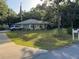 Beautiful home on a large lot featuring lush green landscaping, mature trees and long driveway at 3579 Sw Shorewood Dr, Dunnellon, FL 34431