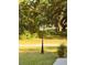 Front yard featuring a decorative lamppost at 3579 Sw Shorewood Dr, Dunnellon, FL 34431