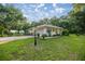 Charming single story home with an attached garage and lush lawn at 3579 Sw Shorewood Dr, Dunnellon, FL 34431