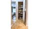 Hall closet with shelving, located off the bedroom, providing convenient and organized storage space at 3579 Sw Shorewood Dr, Dunnellon, FL 34431
