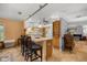 Open kitchen with a breakfast bar, pendant lighting, and views into the living area at 3579 Sw Shorewood Dr, Dunnellon, FL 34431