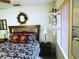 Charming main bedroom with a decorative seashell mobile and window creating a serene and stylish atmosphere at 3579 Sw Shorewood Dr, Dunnellon, FL 34431