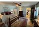 Main bedroom with area rug, ceiling fan, decorative accents, and lots of natural light at 3579 Sw Shorewood Dr, Dunnellon, FL 34431