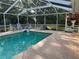 Screened-in pool with plenty of room for lounge chairs and fun water activities at 3579 Sw Shorewood Dr, Dunnellon, FL 34431