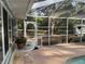 Large screened enclosure offering stunning backyard views and easy access to the outdoor space at 3579 Sw Shorewood Dr, Dunnellon, FL 34431