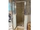 Shower stall featuring a tiled interior and clear glass door, complete with a shower head and soap dish at 3579 Sw Shorewood Dr, Dunnellon, FL 34431
