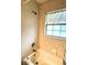 Nicely tiled bathtub with shower head and window provides a relaxing and bright bathing experience at 3579 Sw Shorewood Dr, Dunnellon, FL 34431