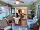 Charming sunroom with views to the living room and outdoor patio with a glimpse of the pool at 3579 Sw Shorewood Dr, Dunnellon, FL 34431