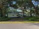 Scenic property view with a storage shed, fencing, mature trees, and ample space at 3579 Sw Shorewood Dr, Dunnellon, FL 34431